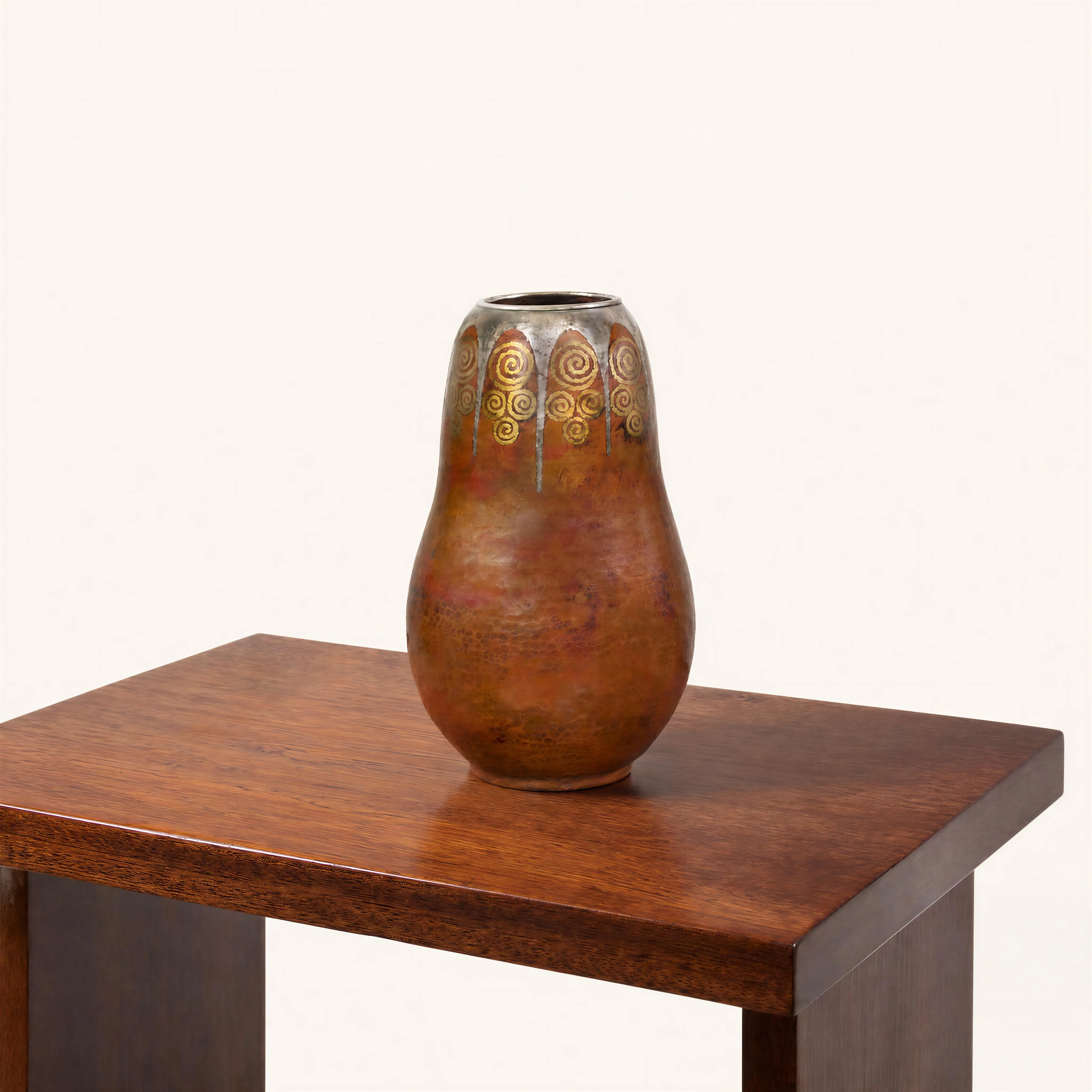Dinanderie vase with circular gold and silver motif