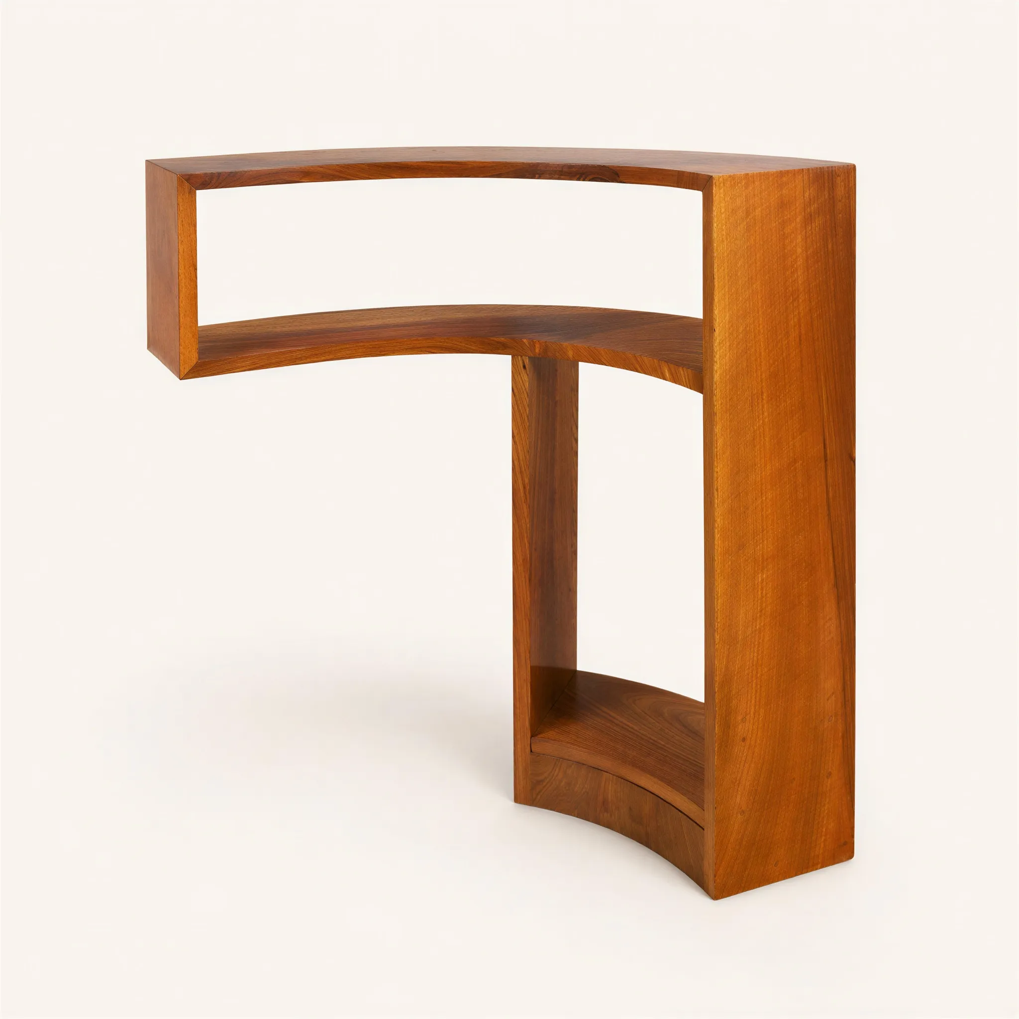 A small curved walnut bookcase. The asymmetrical structure features a long, sinuous top shelf that creates a dramatic cantilever on one side. It is supported at the other end by solid vertical panels, defining a two-tiered open lower storage compartment. 

