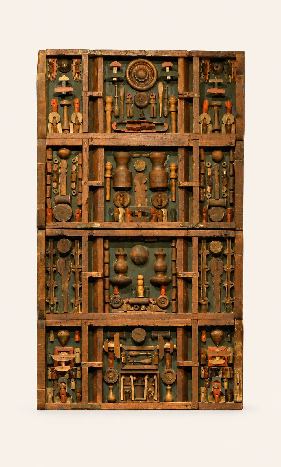 Mixed media on wood. 
A vertical wooden assemblage structured in the manner of a multi-compartment shadow box or cabinet of curiosities, divided into four primary registers, each split into three sections. The composition incorporates numerous found, turned, and carved wooden objects. These elements are arranged symmetrically and accented with subtle touches of red, orange, and white paint, set against a painted gray-green background. The overall structure evokes a totemic design or a collection of miniature idols.
Signed « Avril Armand » et dated « 1971 »