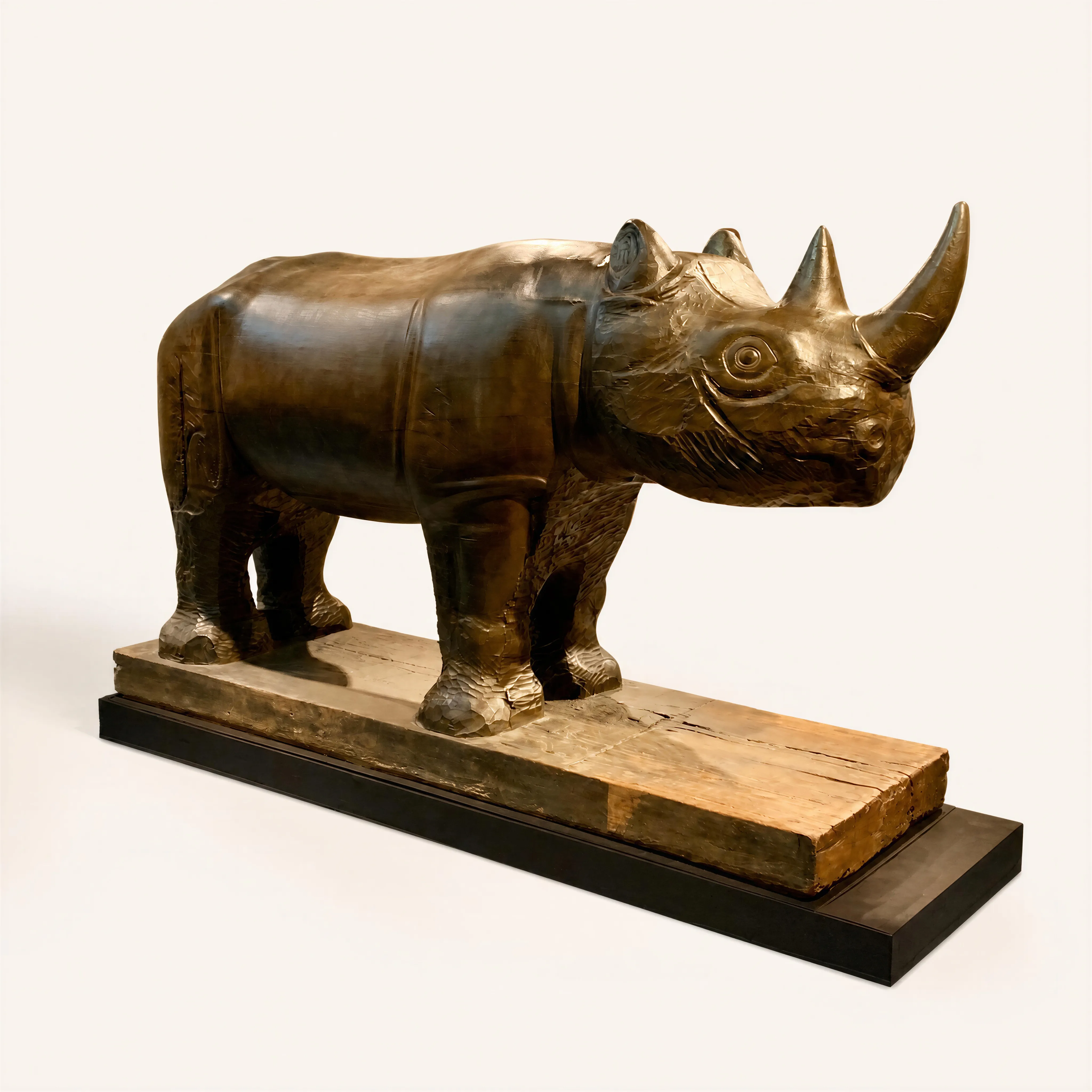 This monumental direct-carving sculpture depicts a young rhinoceros in a powerful, static stance, firmly set upon an integrated rectangular base. Carved from a solid block of mahogany wood, the piece is characterized by simplified, massive, and geometric volumes, highly representative of the finest Art Deco animalier sculpture. The detailed execution of the head emphasizes the animal's natural armor, its horn, and the heavy folds of its hide, creating a beautiful contrast with the smoother surfaces of its body.  
The sculpture bears the following engraved inscription: "Mateo Hernandez Bejar 1885 Meudon 1949 Rhinoceros 1936 Mahogany". This masterpiece is fully documented and referenced in the monograph Mateo Hernandez, Un escultor espagnol en Paris (Junta de Castilla y León, 1998, pages 264 and 265). 